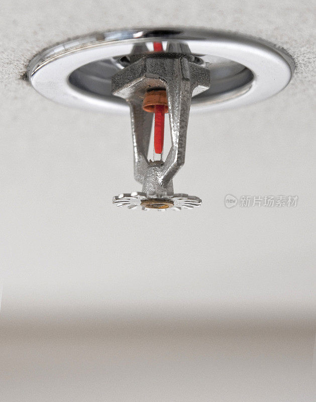 Close up a fire sprinkler in ceiling